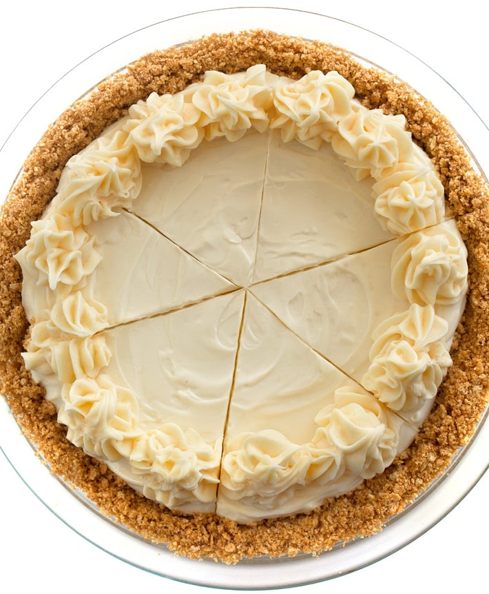 Whole Cheesecake Sliced decorated with piped frosting
