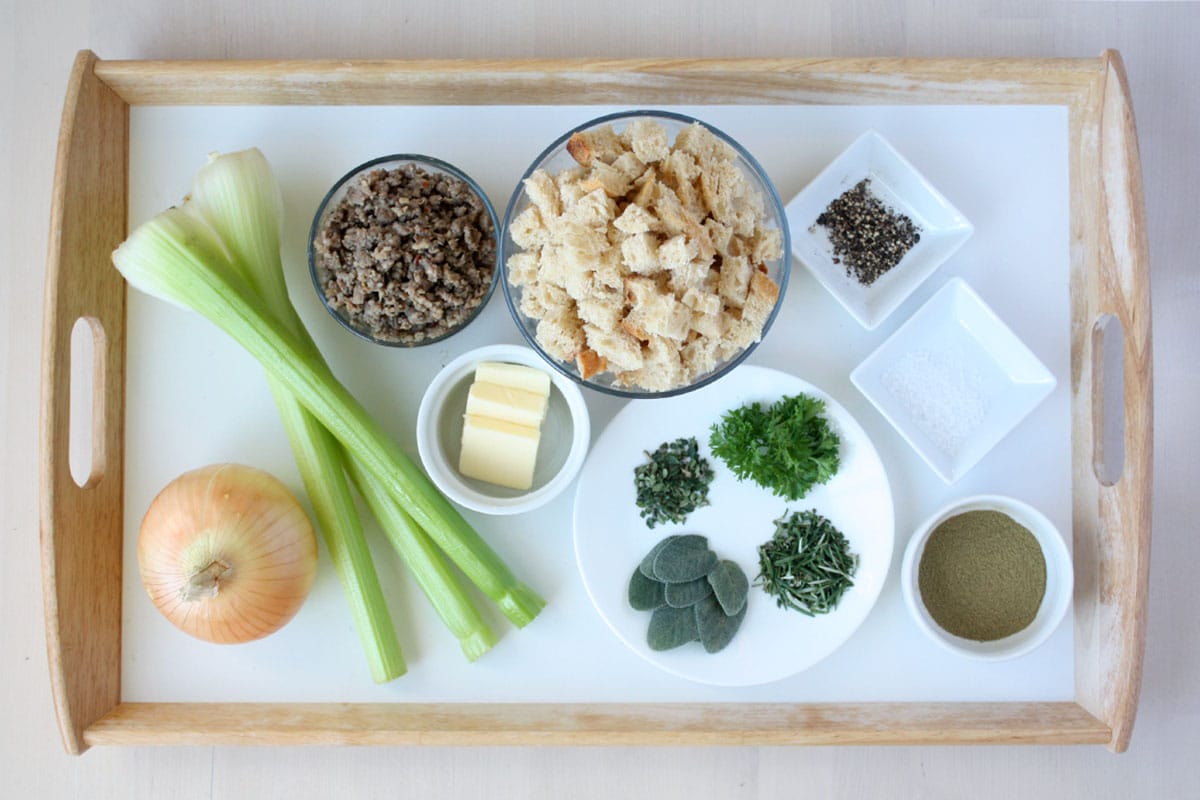 ingredients for homemade stuffing on a wooden tray