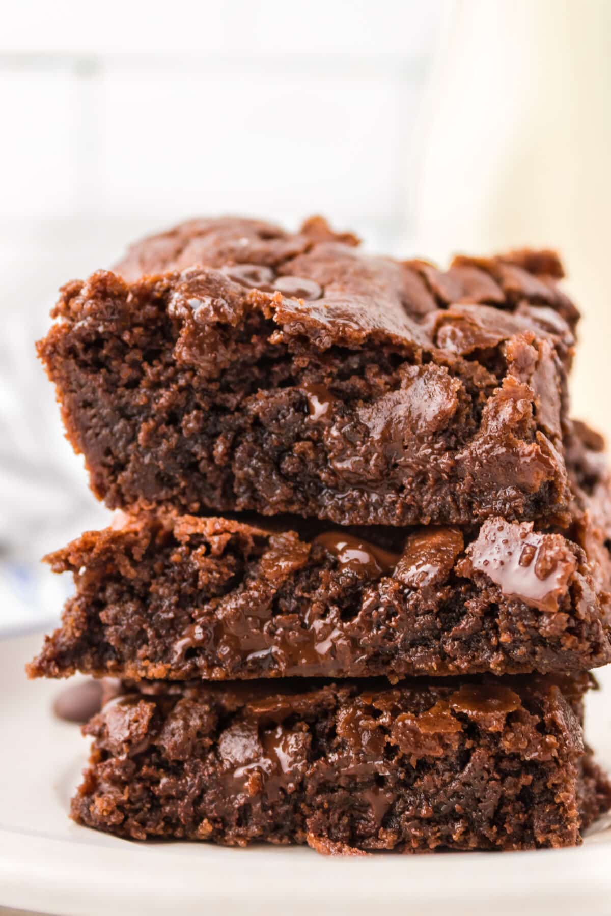 A stack of gooey homemade chocolate chip brownies