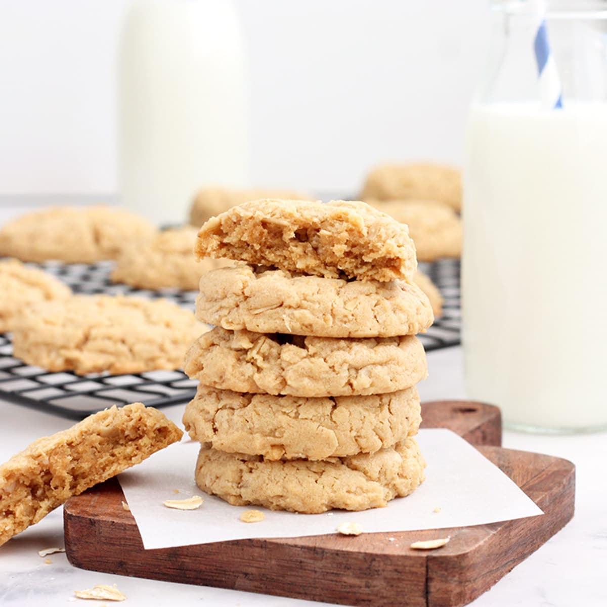 peanut butter oatmeal cookies stacked on a wooden board