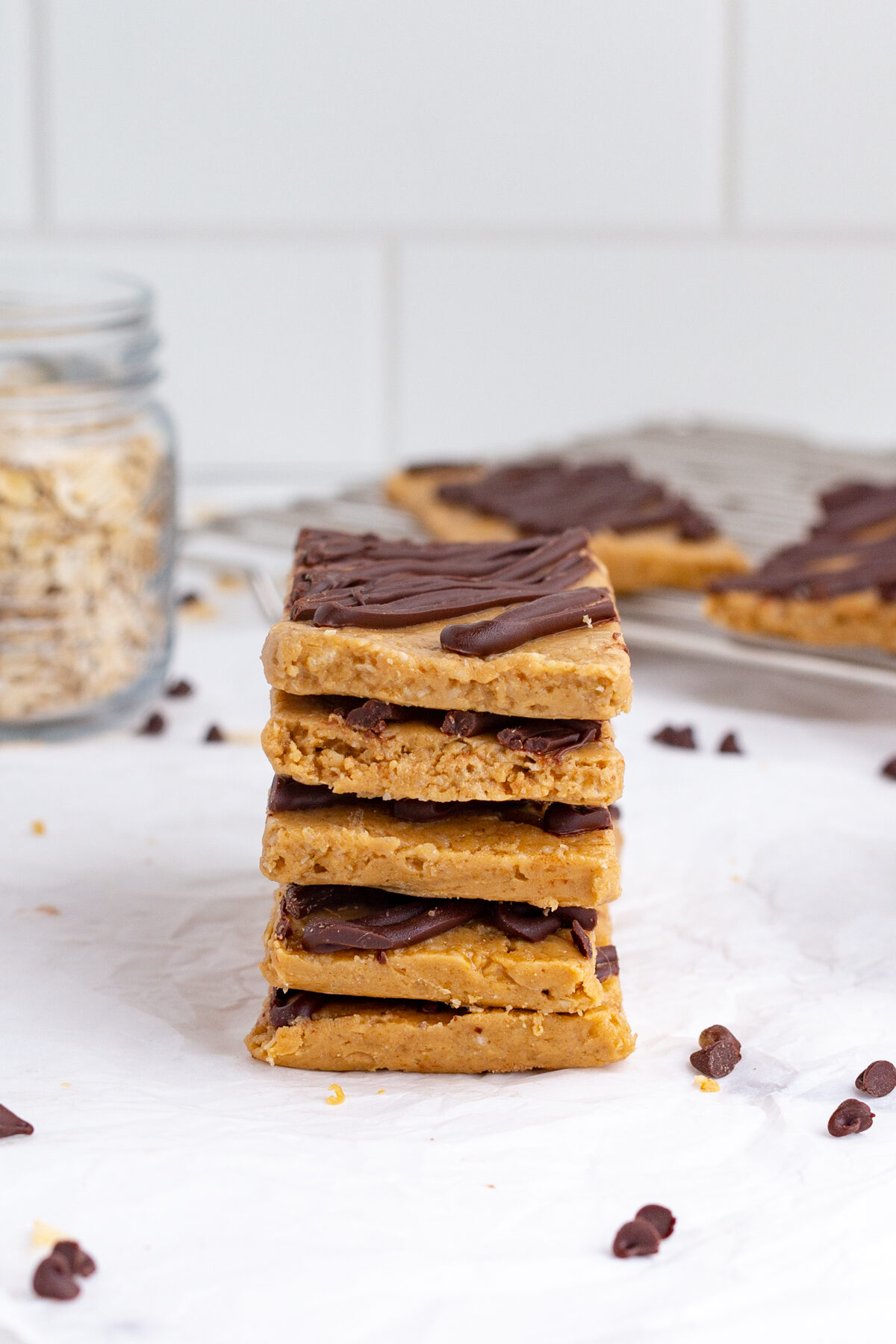 a stack of homemade protein bars drizzled with chocolate