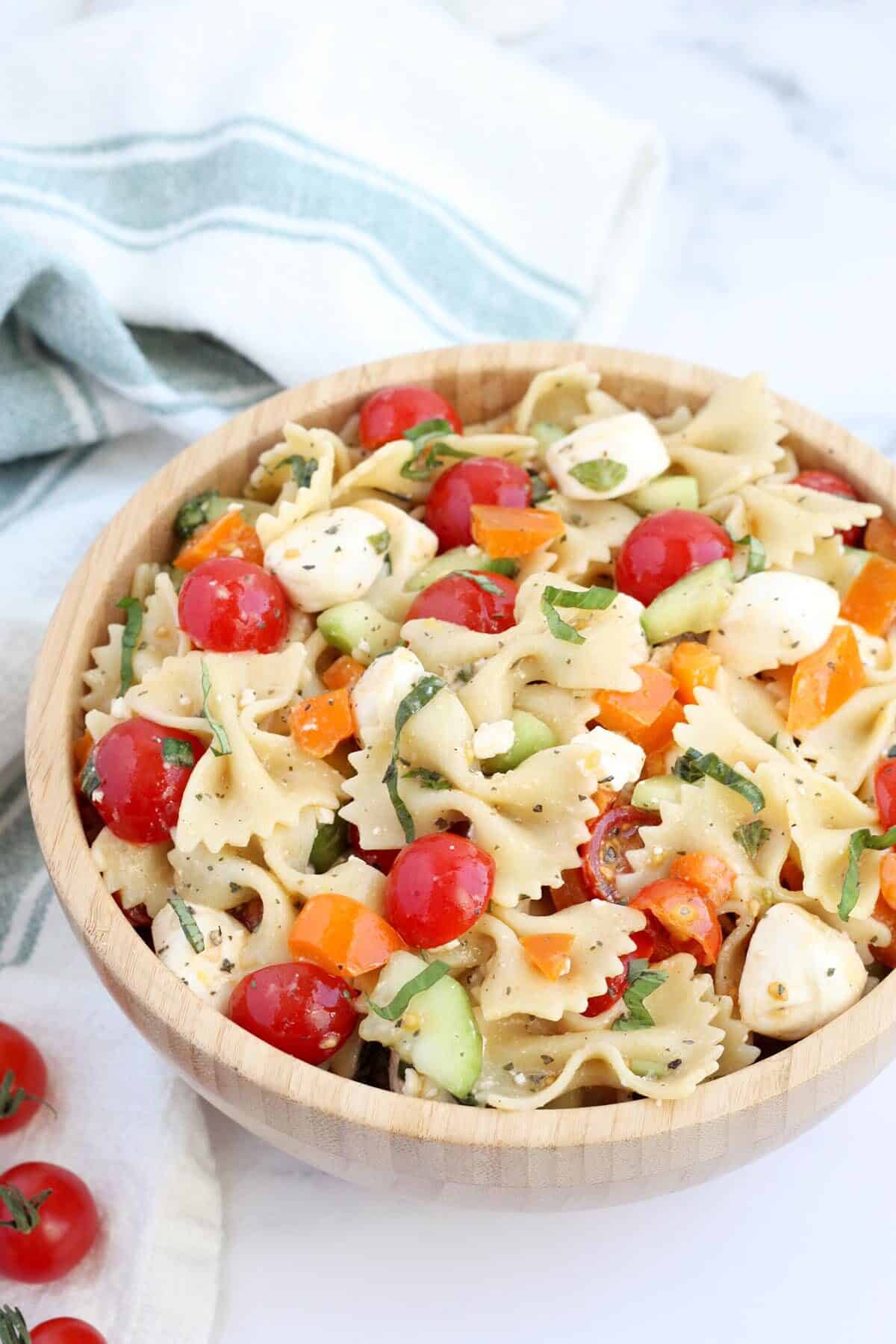 pasta salad with tomatoes, mozzarella and fresh basil