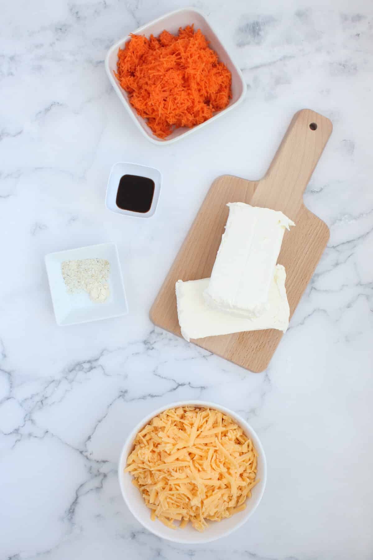 Ingredients for Carrot Cheese Ball. Shredded carrots, worcestershire sauce, cream cheese, garlic salt, onion powder, and cheese