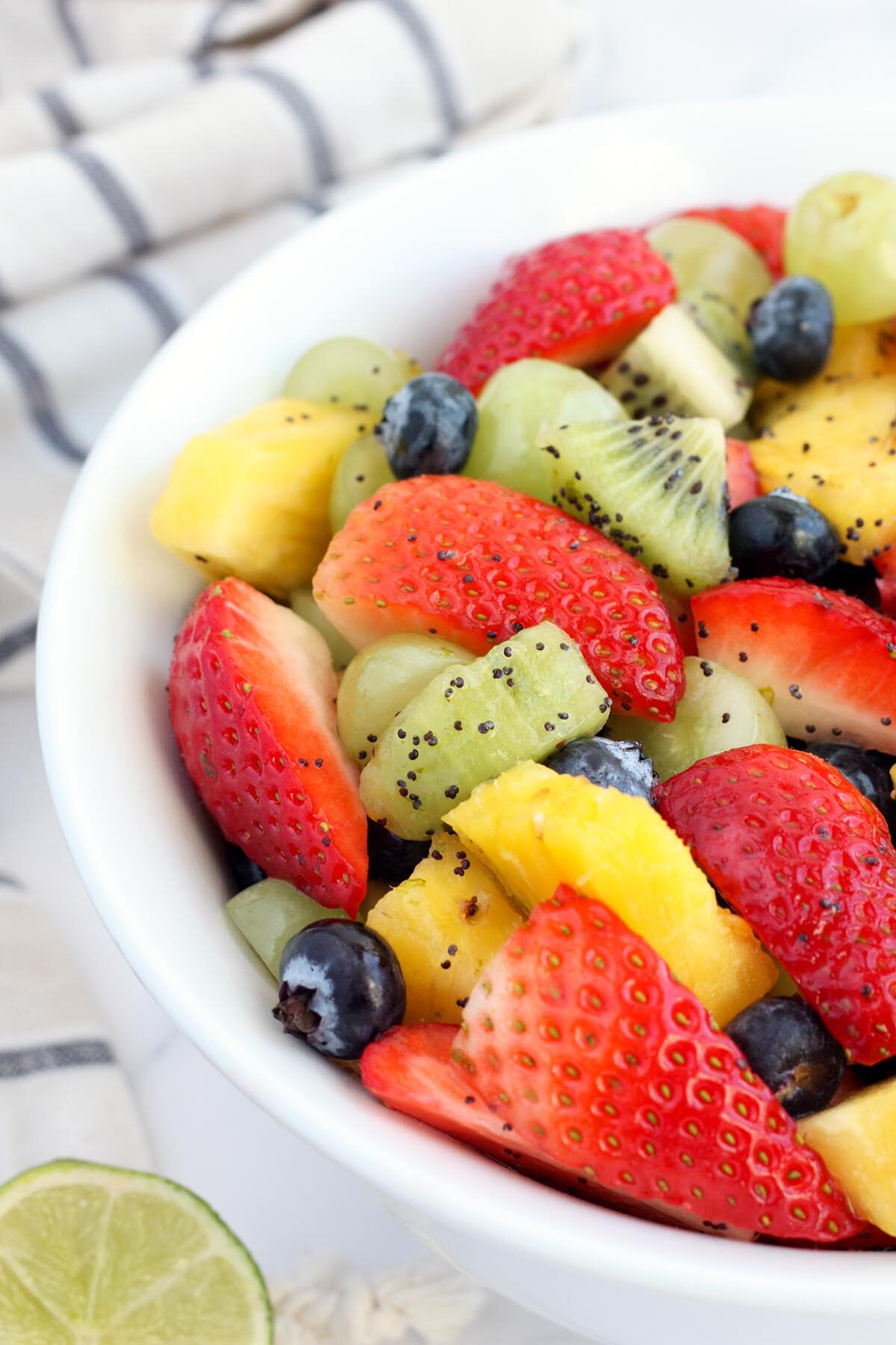 fruit salad topped with poppy seeds