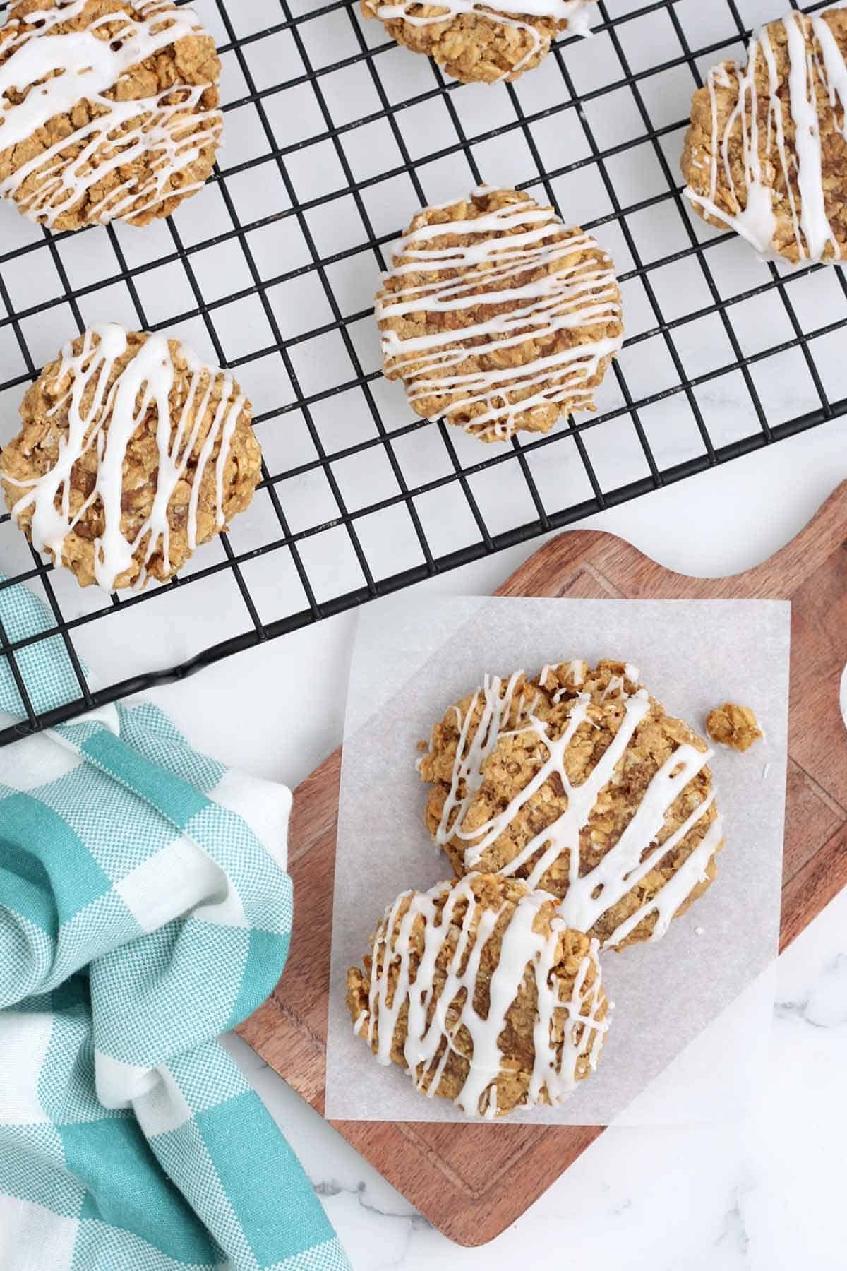 an overhead shot of oatmeal cookies drizzled with icing. 