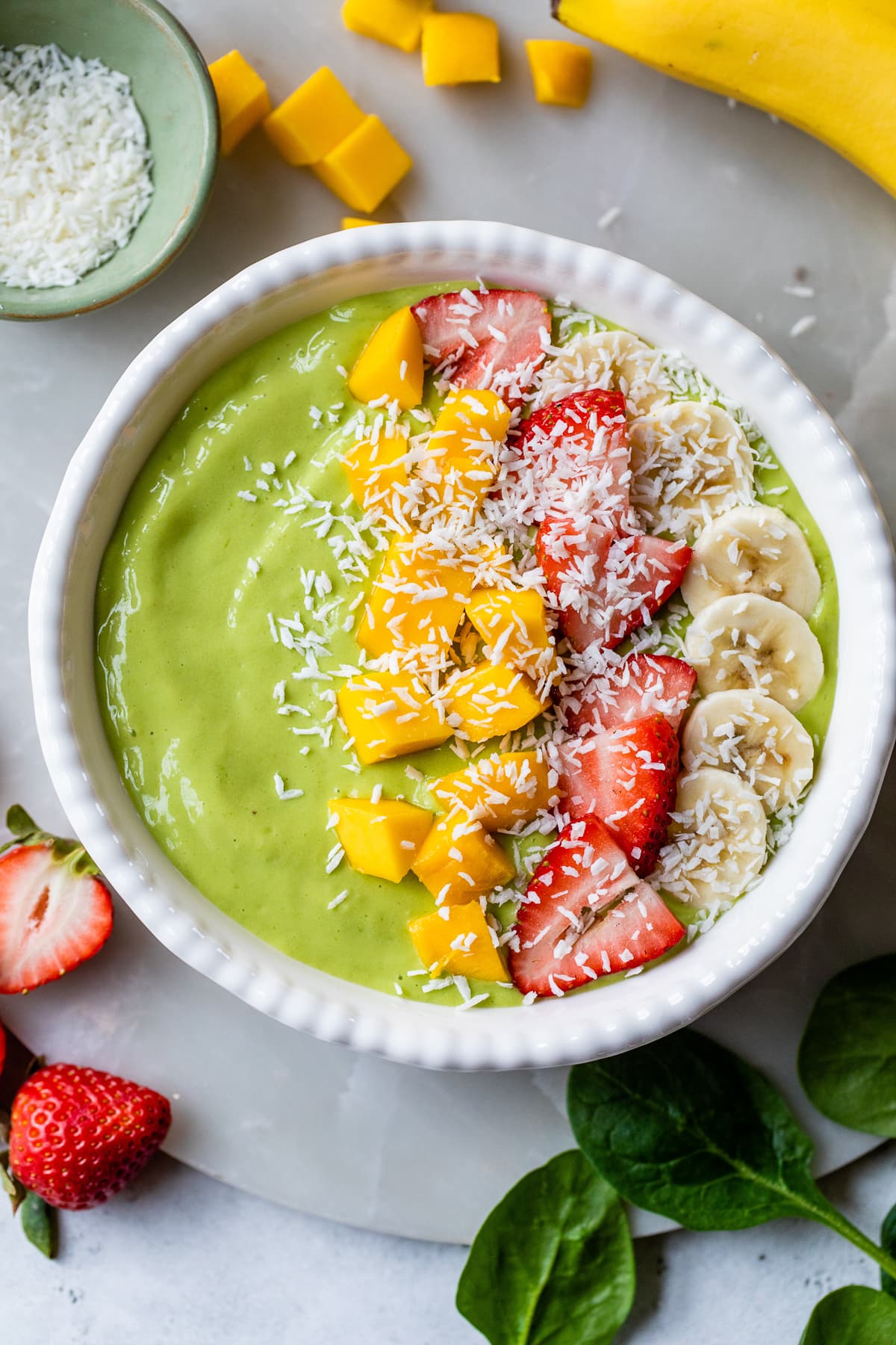 Green Smoothie Bowl with mango and strawberries
