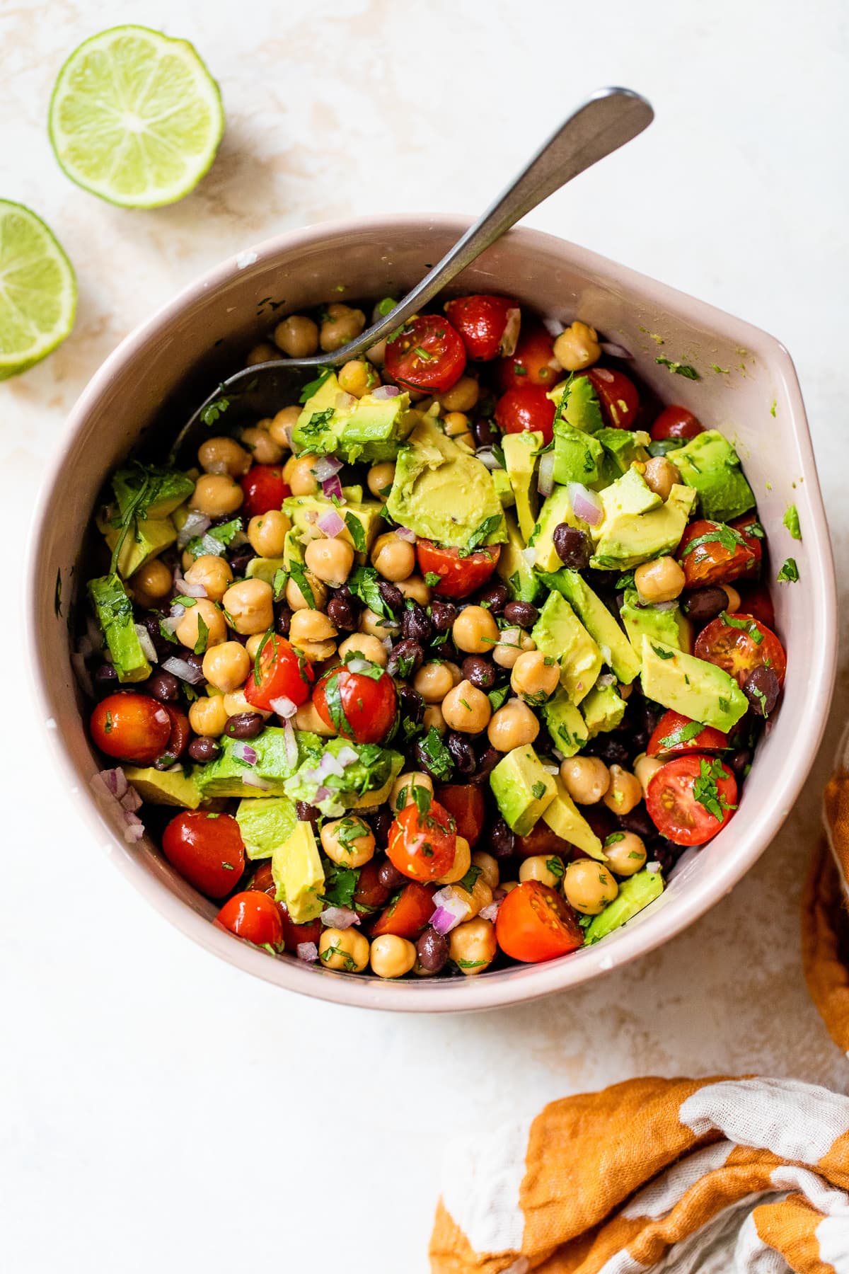 black beans, chickpeas, avocado and tomatoes with lime