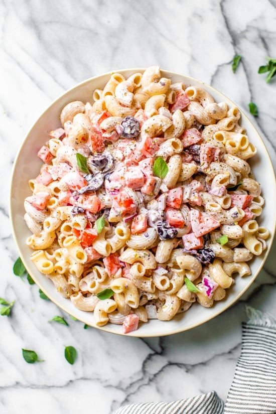 This lighter version of Macaroni Salad with tomatoes and black olives is the perfect side dish for any summer BBQ.