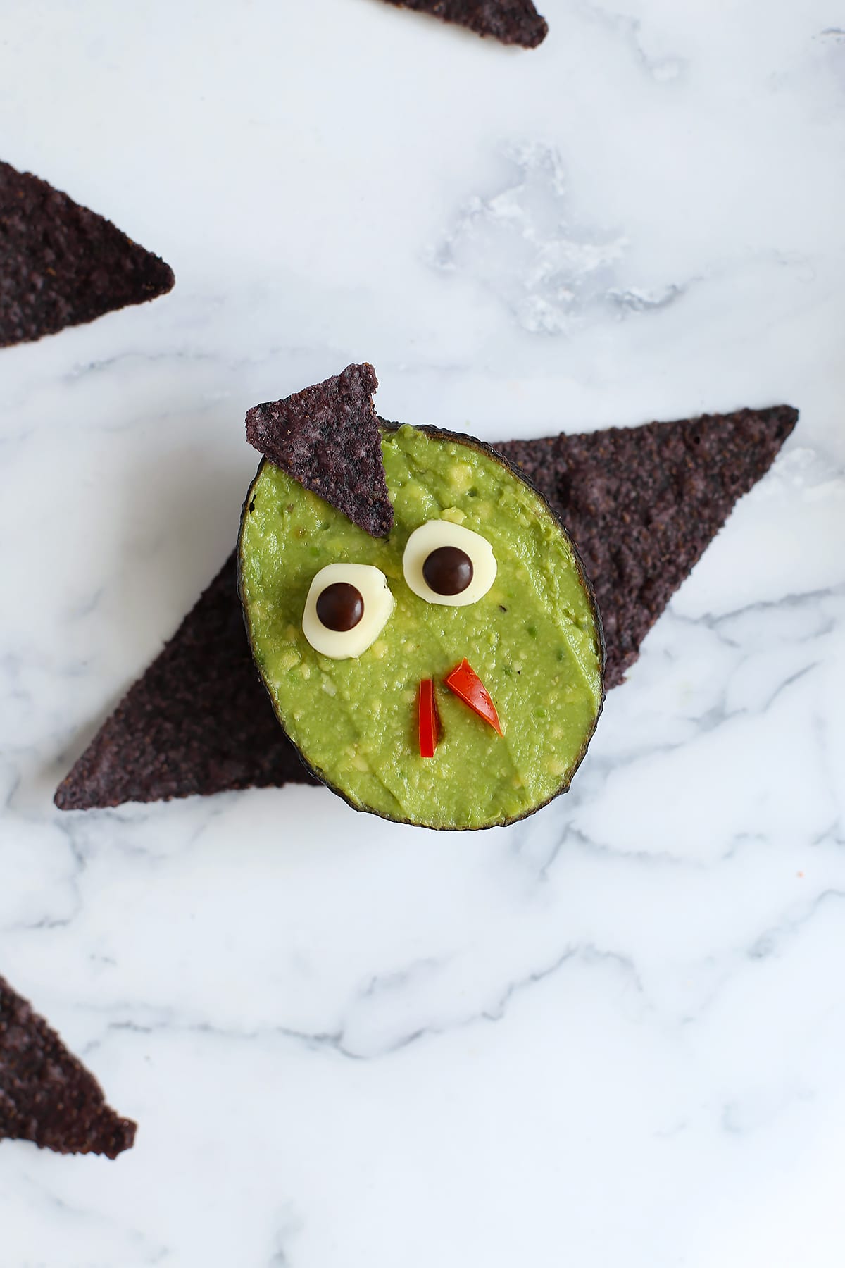 An up close photo of a vampire guacamole cup.