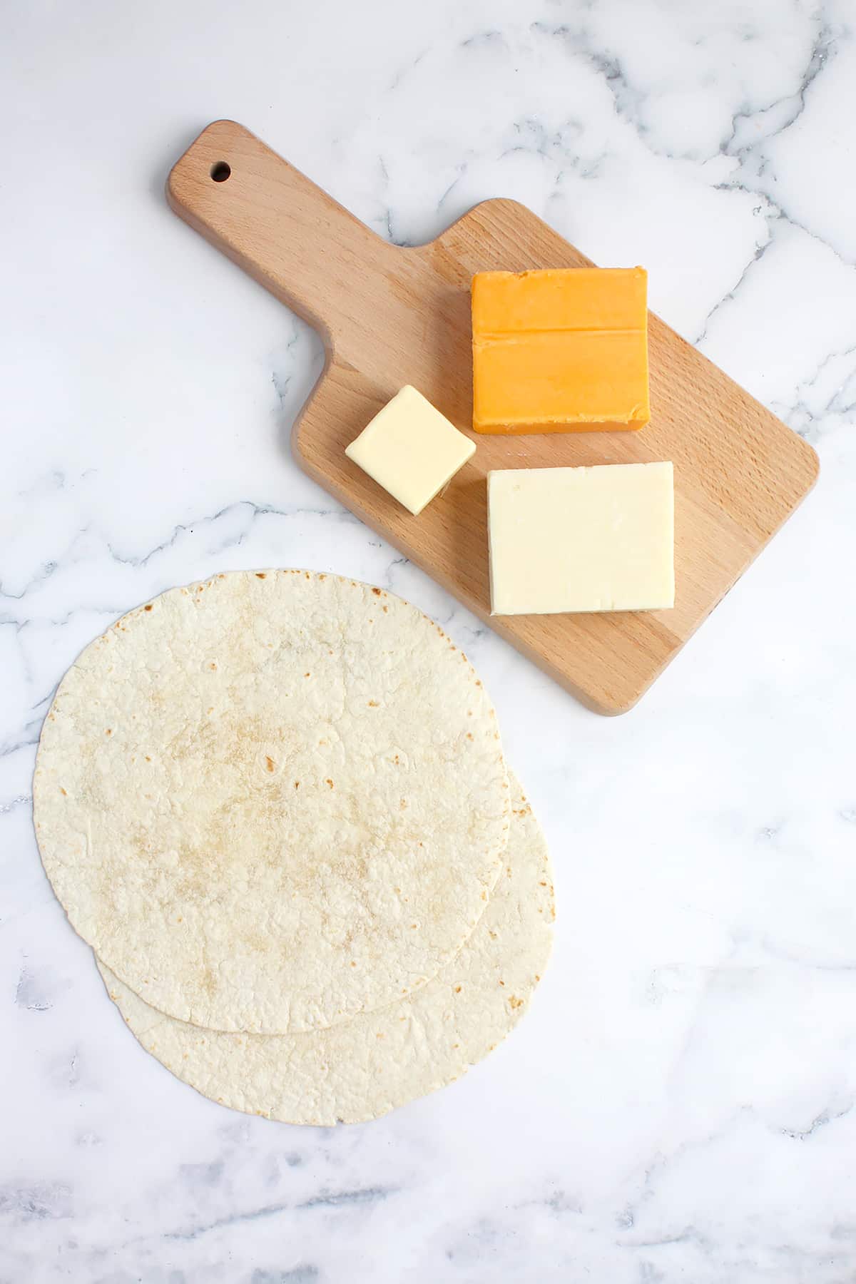 Ingredients needed to make the perfect cheese quesadilla.