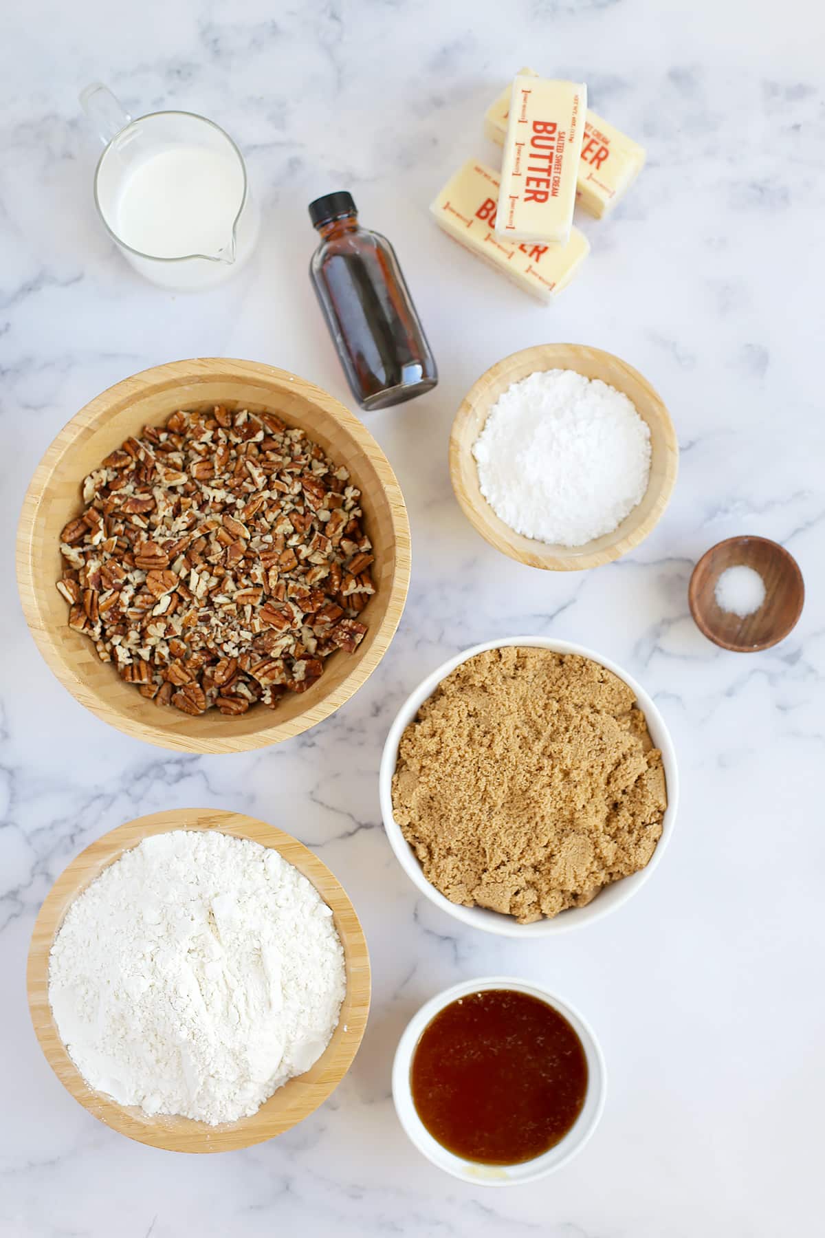 Ingredients needed to make homemade pecan pie bars with shortbread crust.