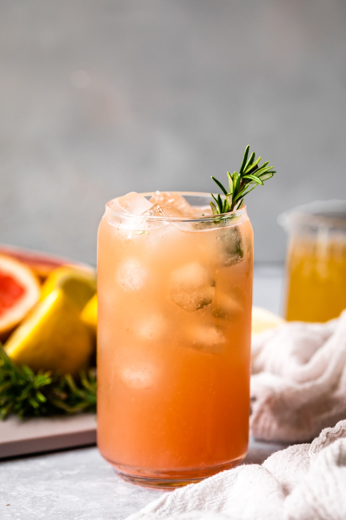 grapefruit mocktail with rosemary sprig in a glass