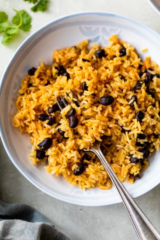 rice and black beans with a fork