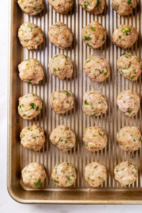 Mini turkey meatballs on a baking sheet