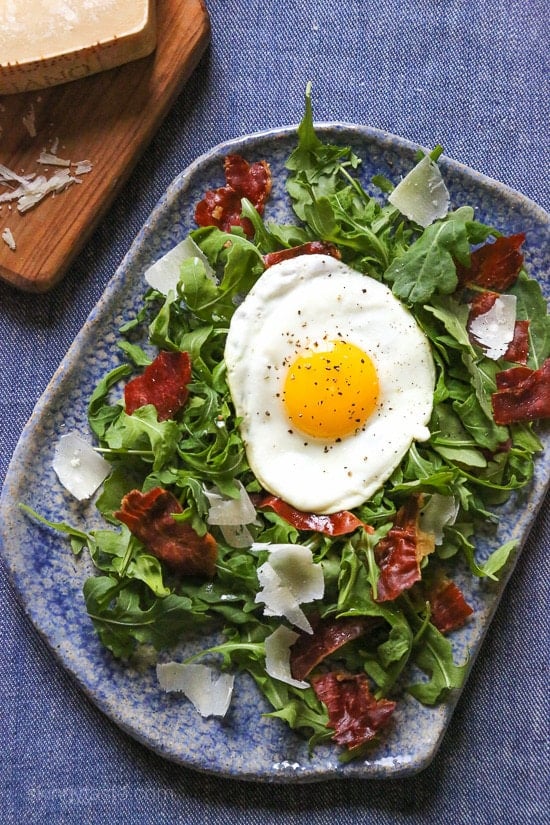 This easy salad has all my favorite things in one – arugula, Proscuitto, shaved Parmesan and a runny egg! When you pop that egg yolk, the salad is bathed in that warm eggy goodness, salad nirvana in every bite! If you are not a fan of runny eggs, hard boiled eggs would taste just fine too!
